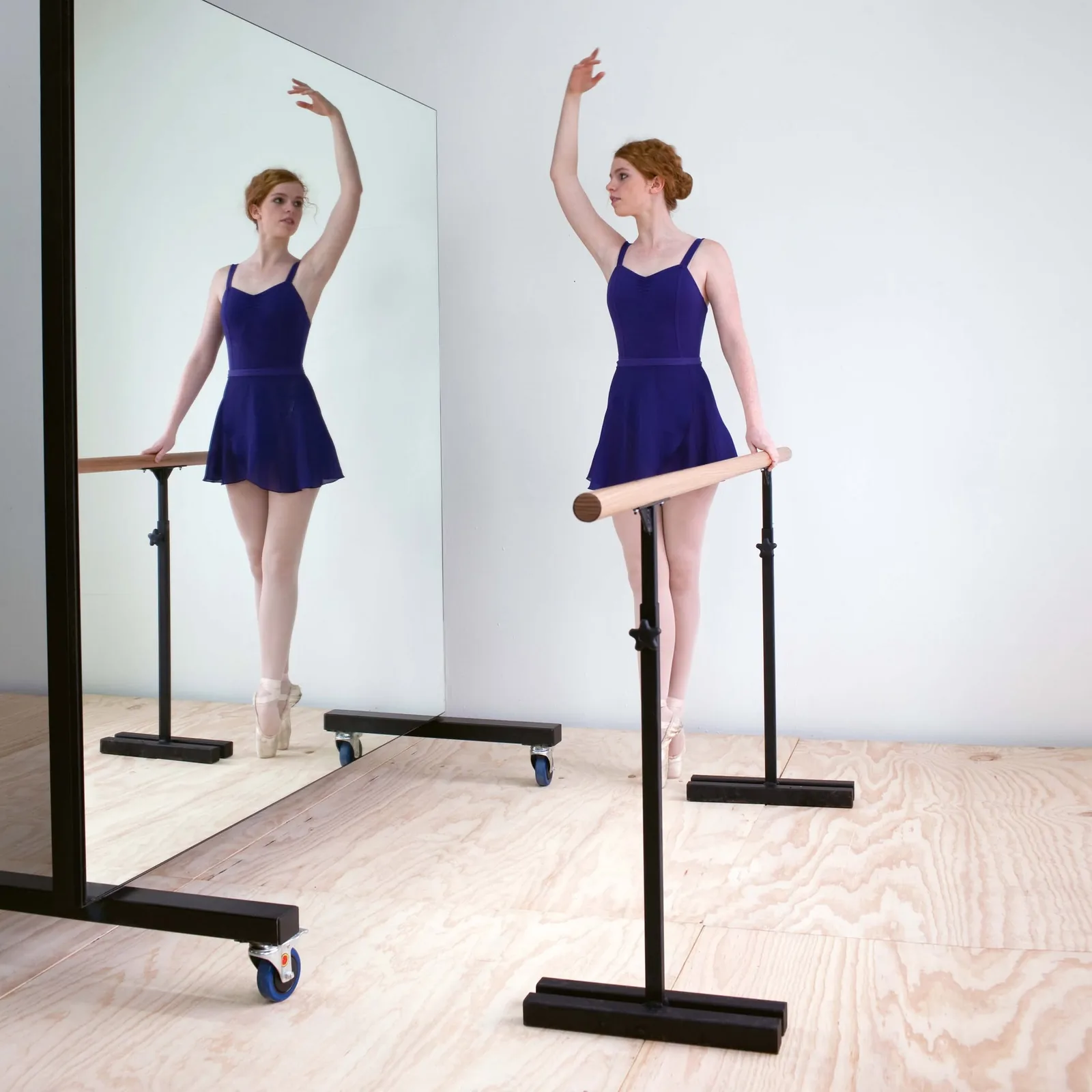 A ballerina at a Show Works ballet barre
